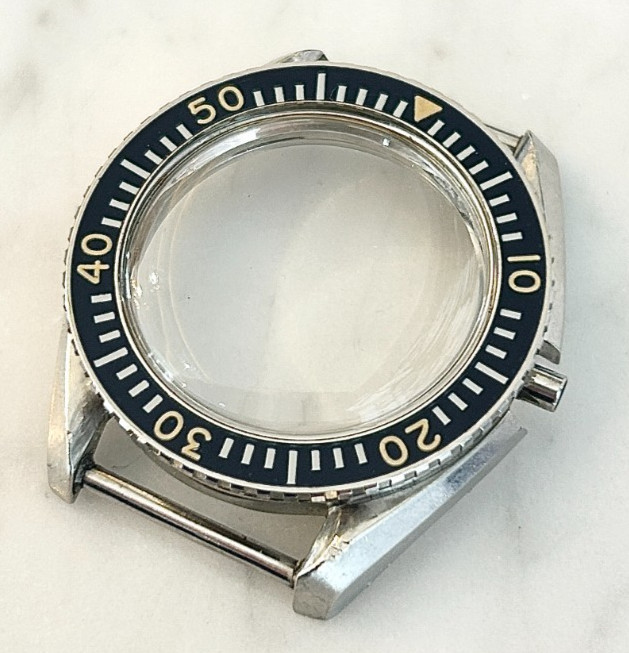 A rare Omega Seamaster 300 Military wristwatch case with blue bakelite bezel.