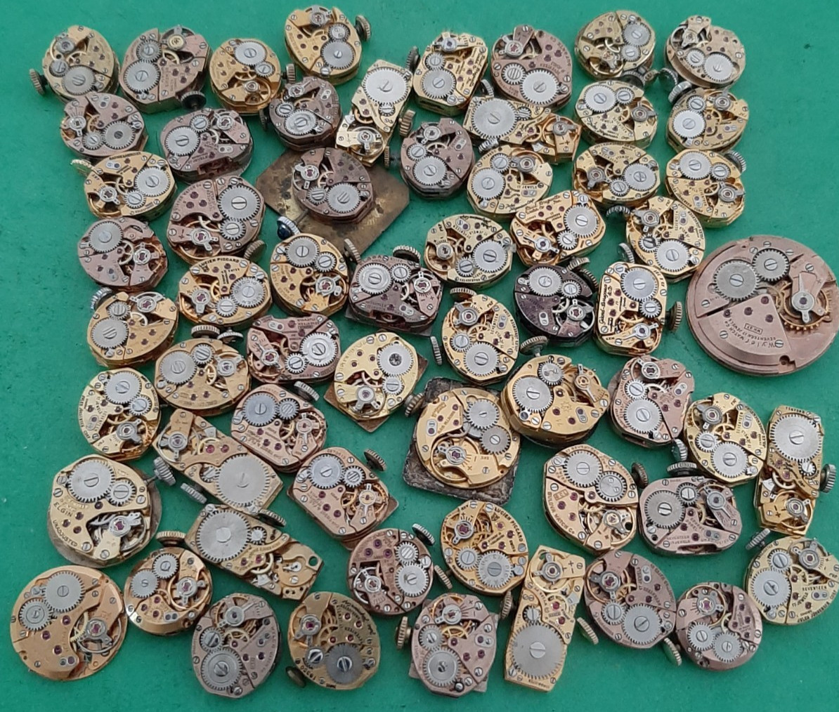 Lot of 60 Mechanical Wrist Watch Movements Parts Repair Manual Gold Cooper Tone