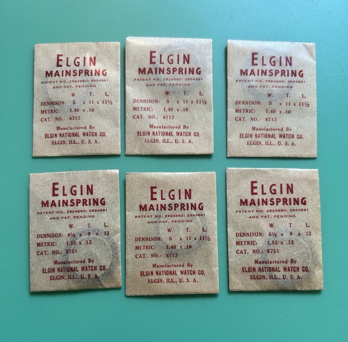 Elgin – 5/0 Cal. – Mainspring – Cat. 6712 – 5 wide x 11 tall x 11 1/2 long -NOS