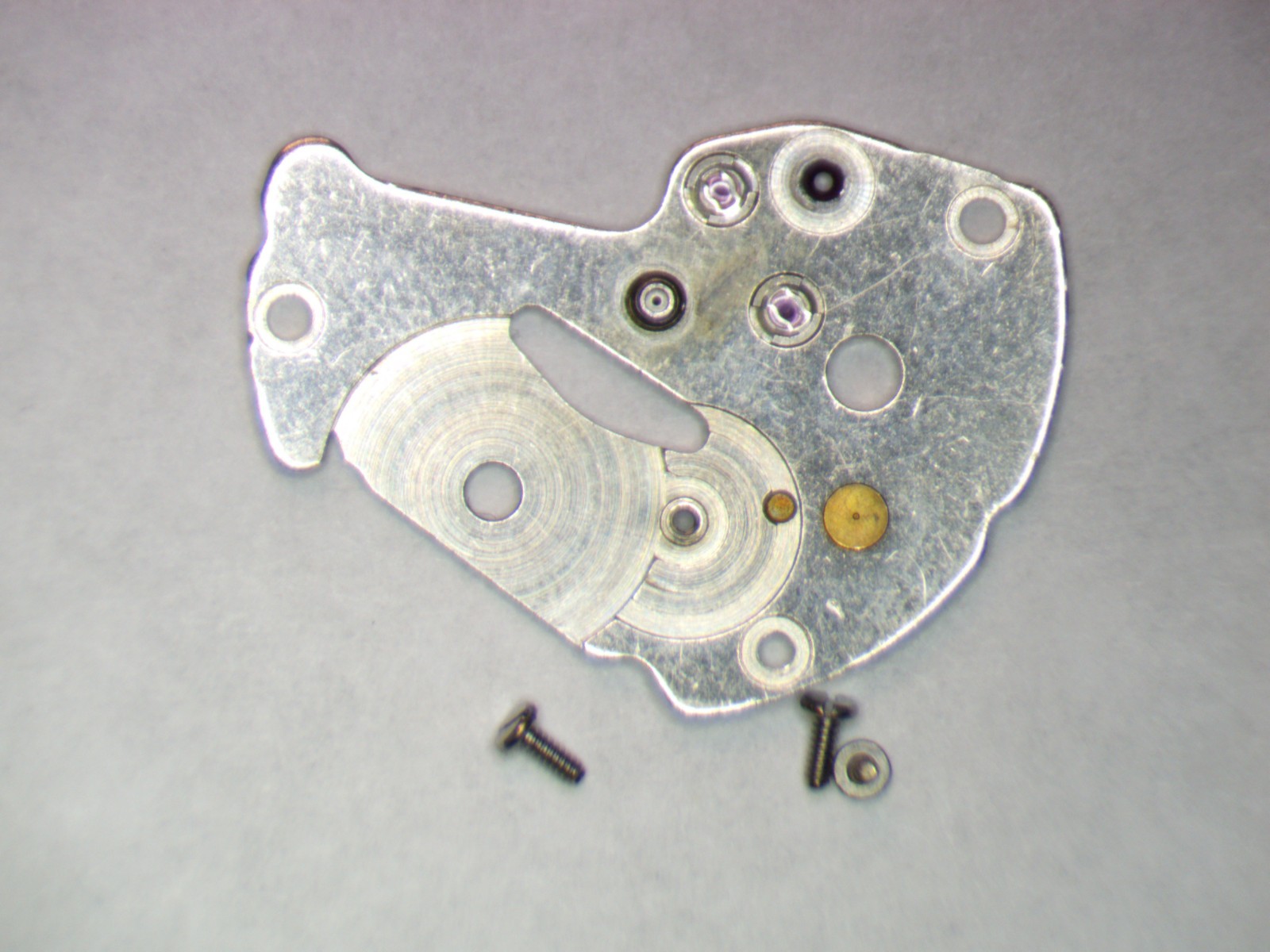 Seiko 7S26A 0112300 Barrel and train wheel bridge w/screws Parts, Repair