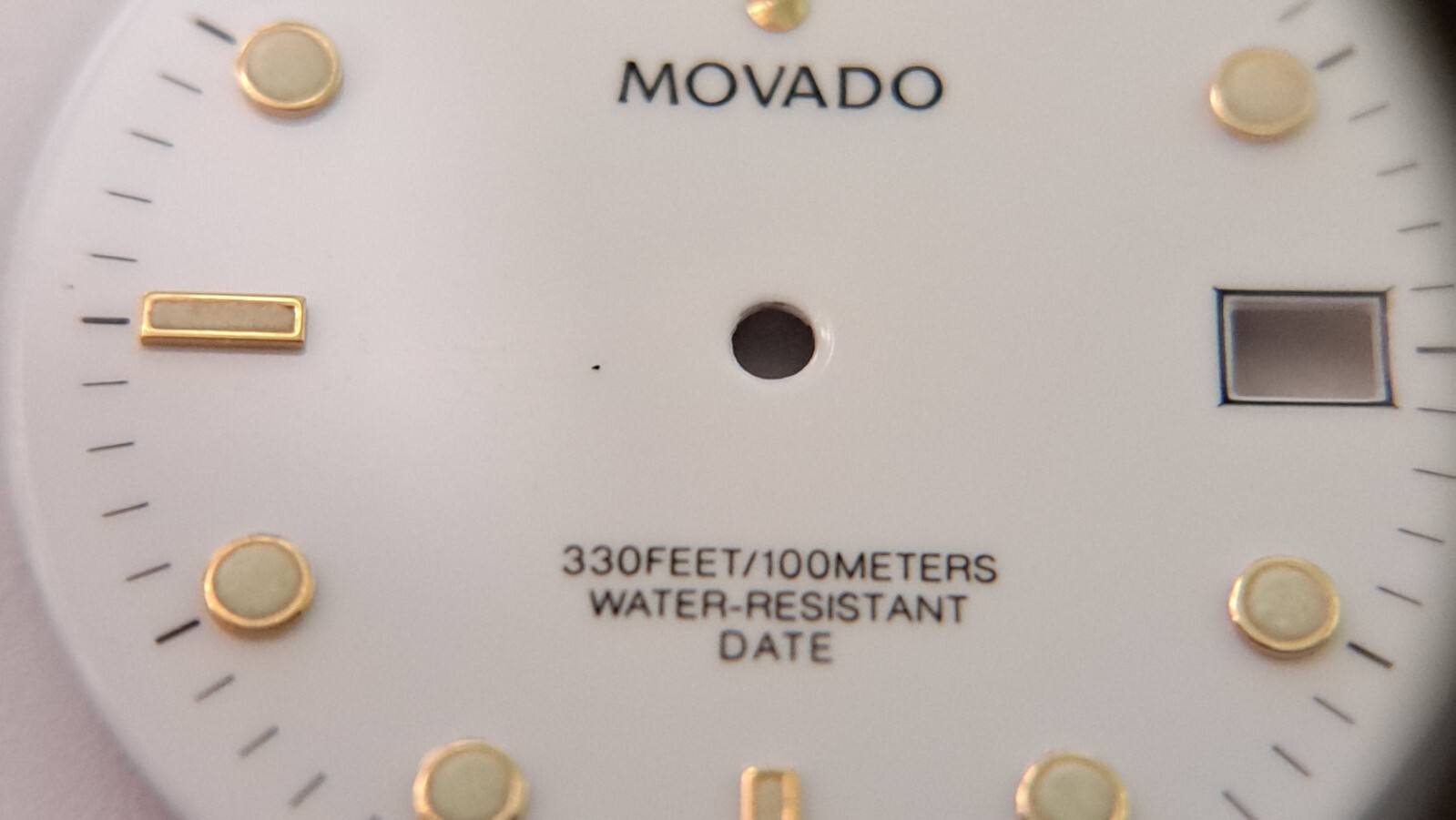 Movado DIAL white with green lume 28.9mm diameter. feet between2 and 3 o’clock a