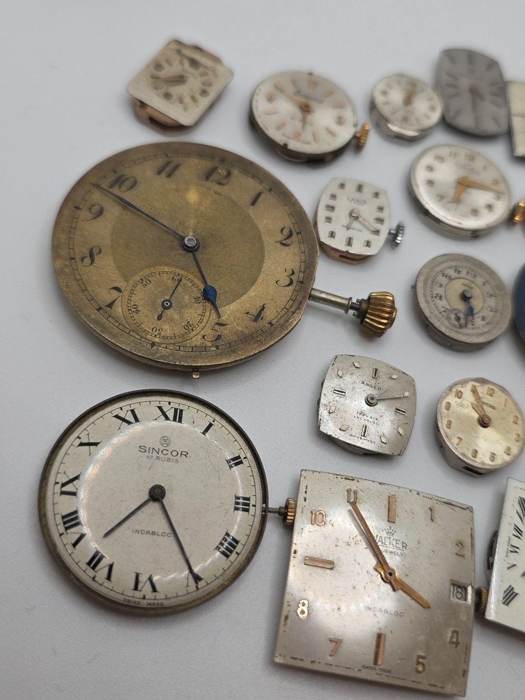 Lot Of 24 Swiss Made Mechanical Movements Complete With Zenith, Revue Dials Etc.
