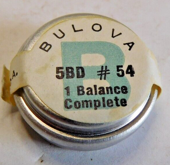 BULOVA 5 BD PART # 54 COMPLETE BALANCE WHEEL. OPEN PACKAGE. NEW OLD STOCK