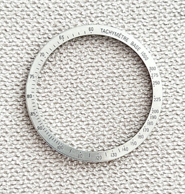 A Vintage Omega Speedmaster Stainless Steel “Tachymetre Base 1000” Watch Bezel.