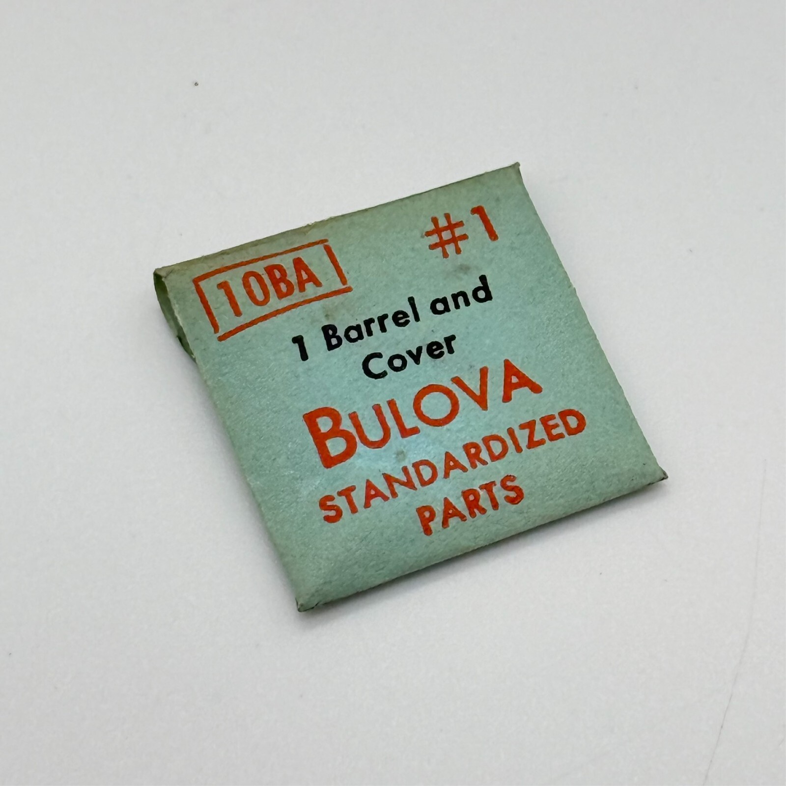 NOS Genuine BULOVA Standardized Caliber 10BA Part Number 1, Barrel and Cover