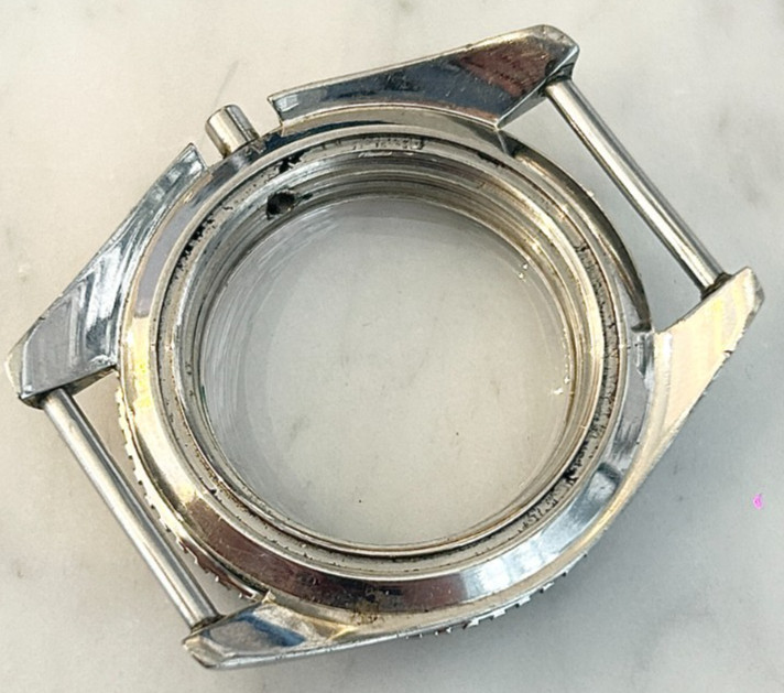 A rare Omega Seamaster 300 Military wristwatch case with blue bakelite bezel.