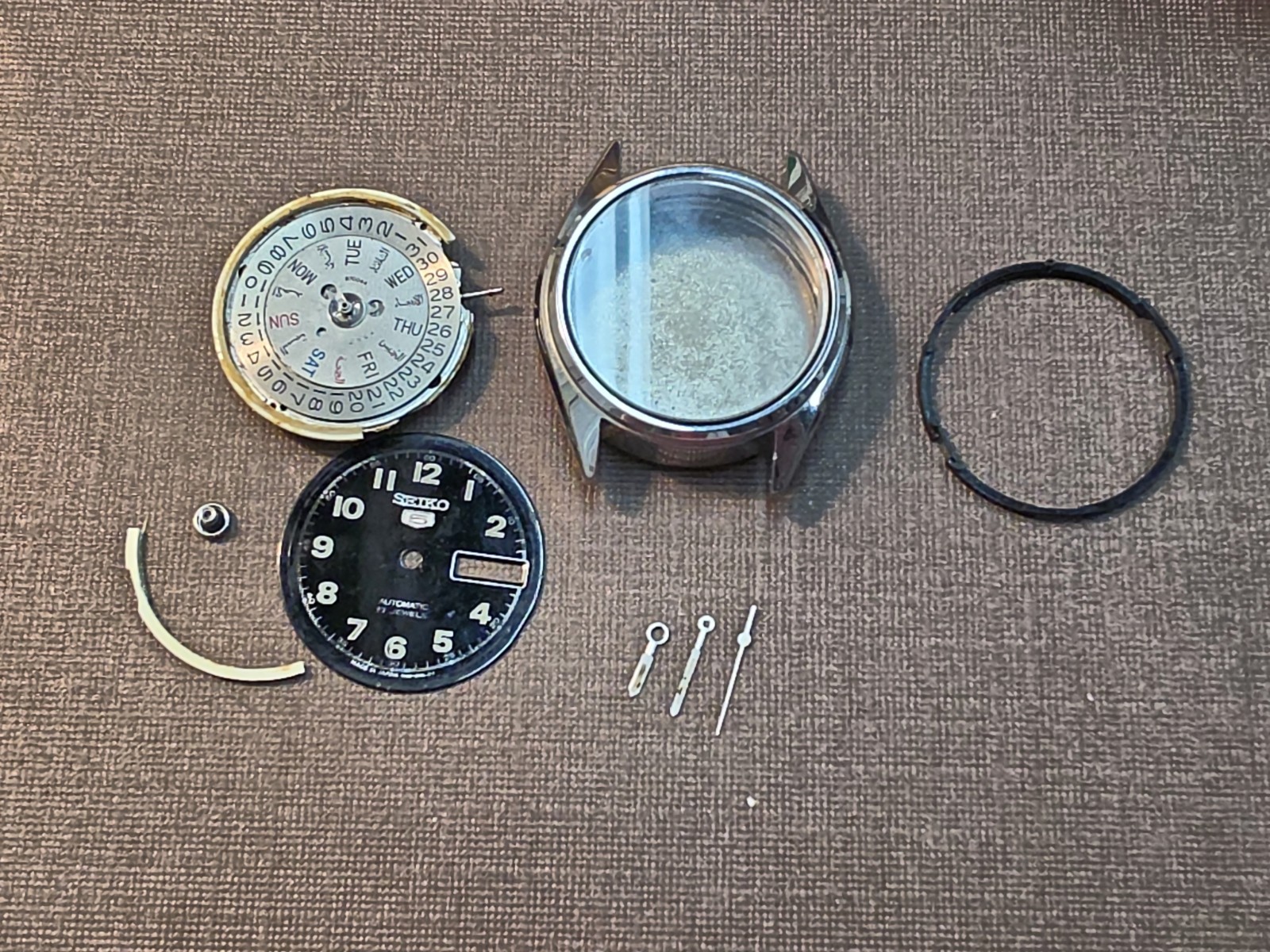 Running Seiko 7009 Mvmt W/Dial, Hands, Case, And Seiko Signed Crystal For Parts