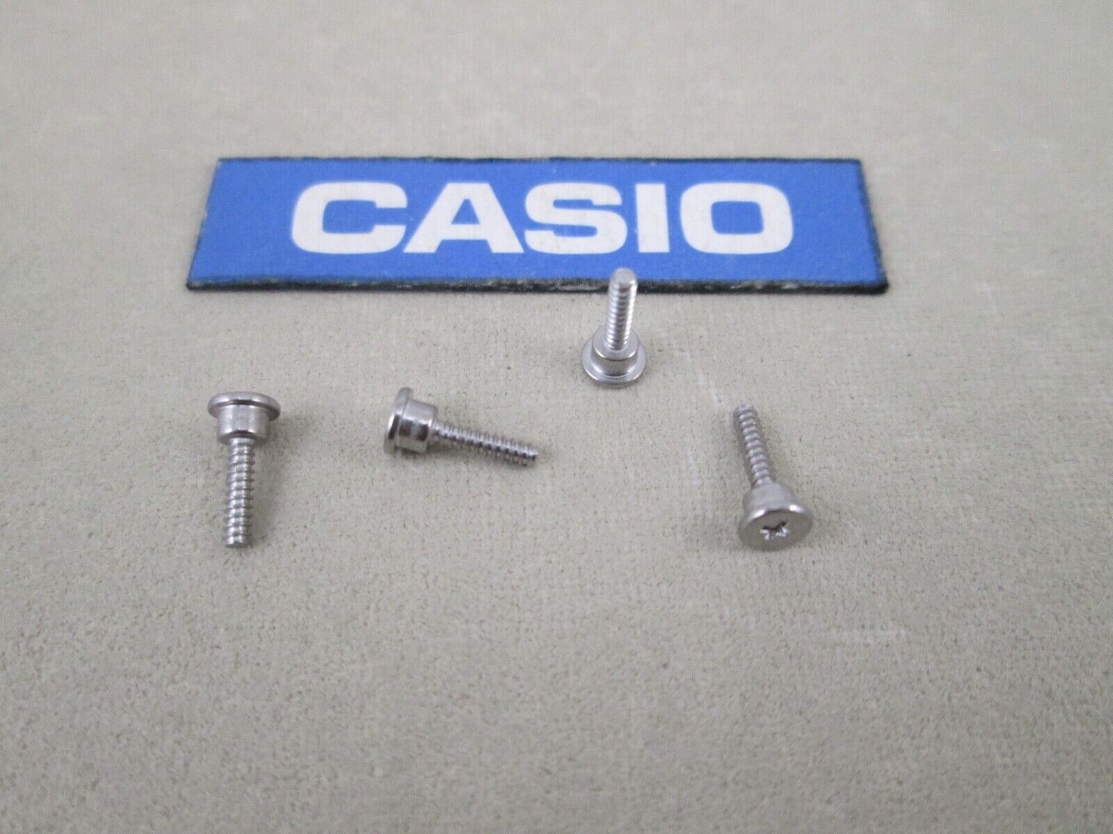 Genuine Casio G-Shock GGB100 GG-B100 silver tone st. steel case back screws X 4
