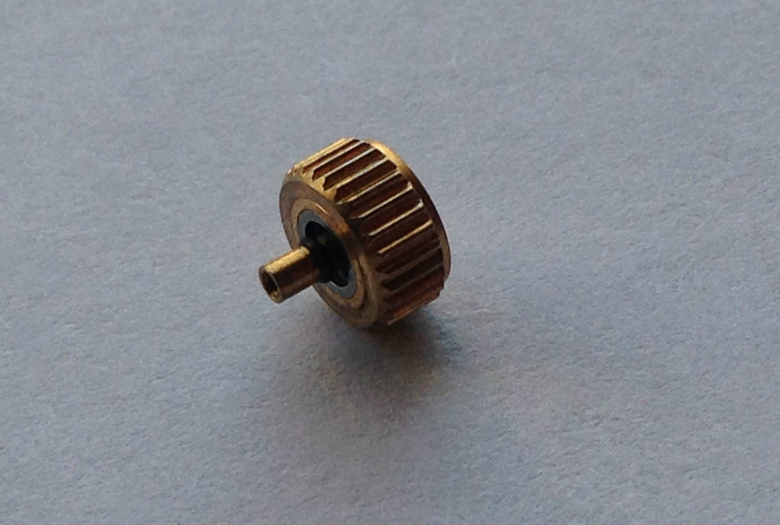 LONGINES YELLOW GOLD PLATED WATCH CROWN KEY (5.53mm x 3.07mm). (L-12)
