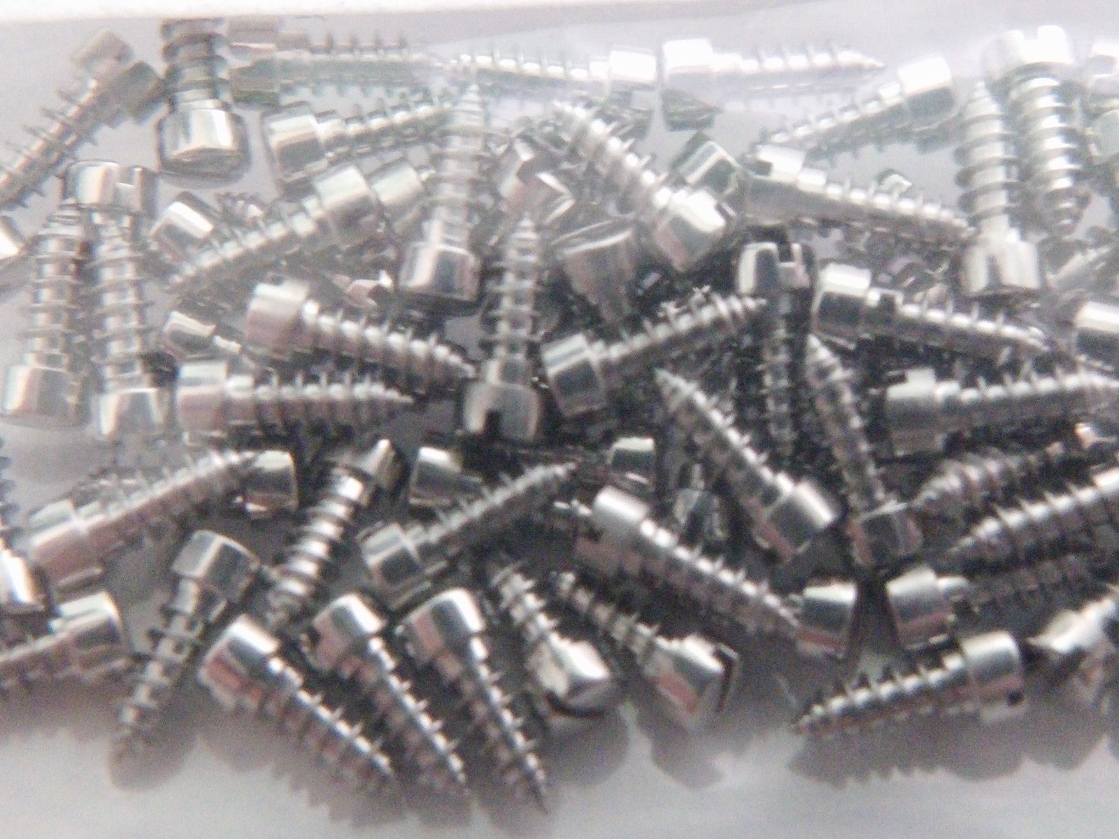 Unbranded case back screws 100 per order-NEW for watch repair