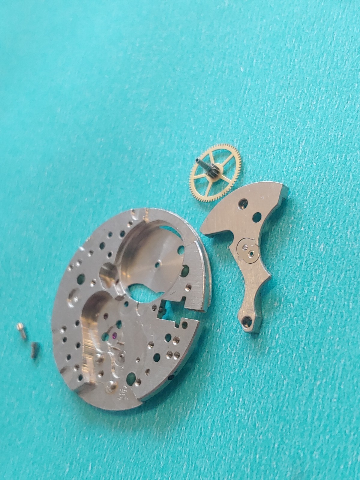 AS Cal. #1187/94 Base Plate, Minute Wheel And Bridge. Screws, Inca Jewel & Clip