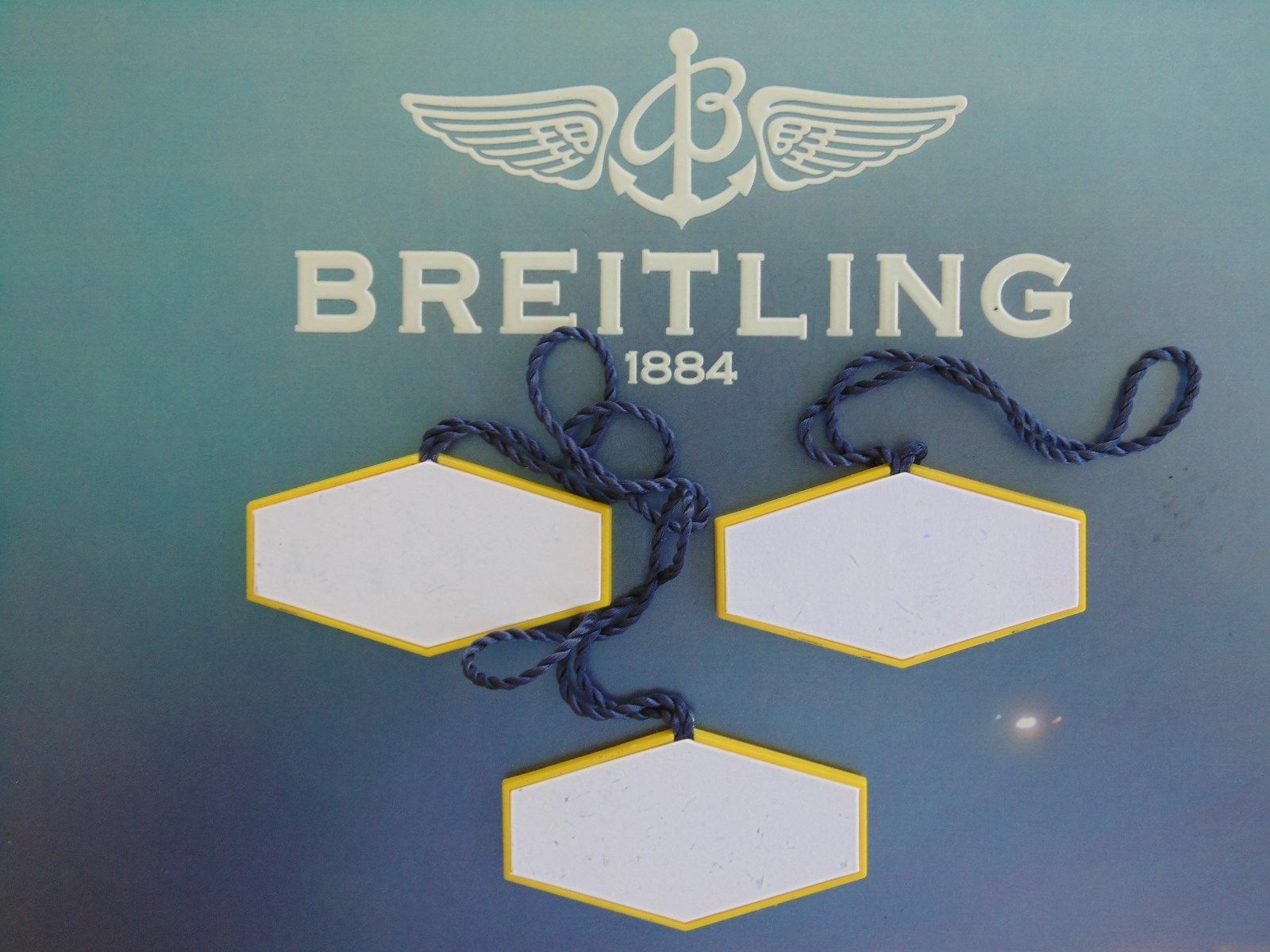 BREITLING FACTORY JEWELERS SALES ACCESSORY YELLOW PLASTIC WATCH HANG / SWING TAG