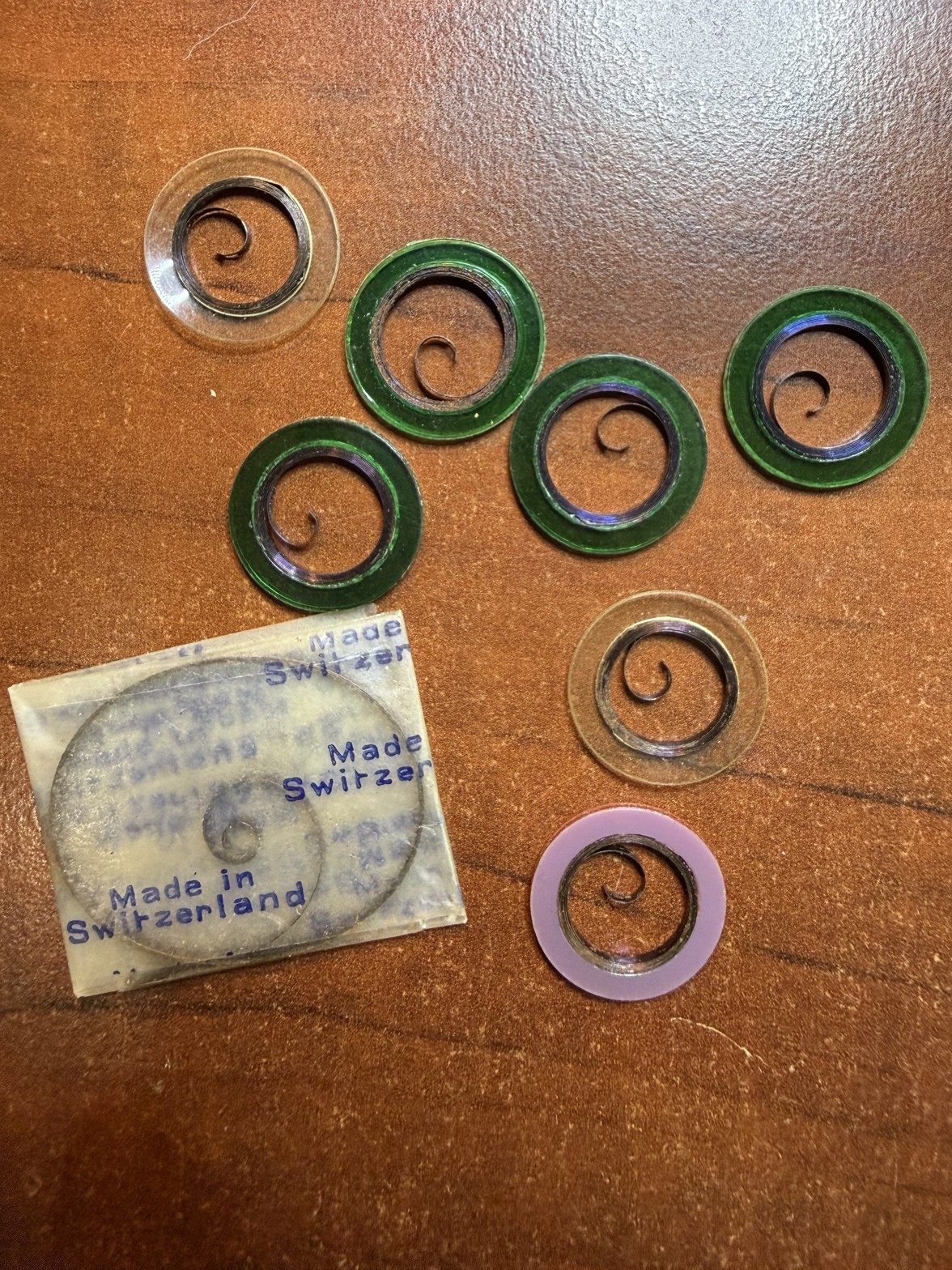 NOS Watch Mainsprings Lot of 8 in Retaining Rings Swiss New Old Stock