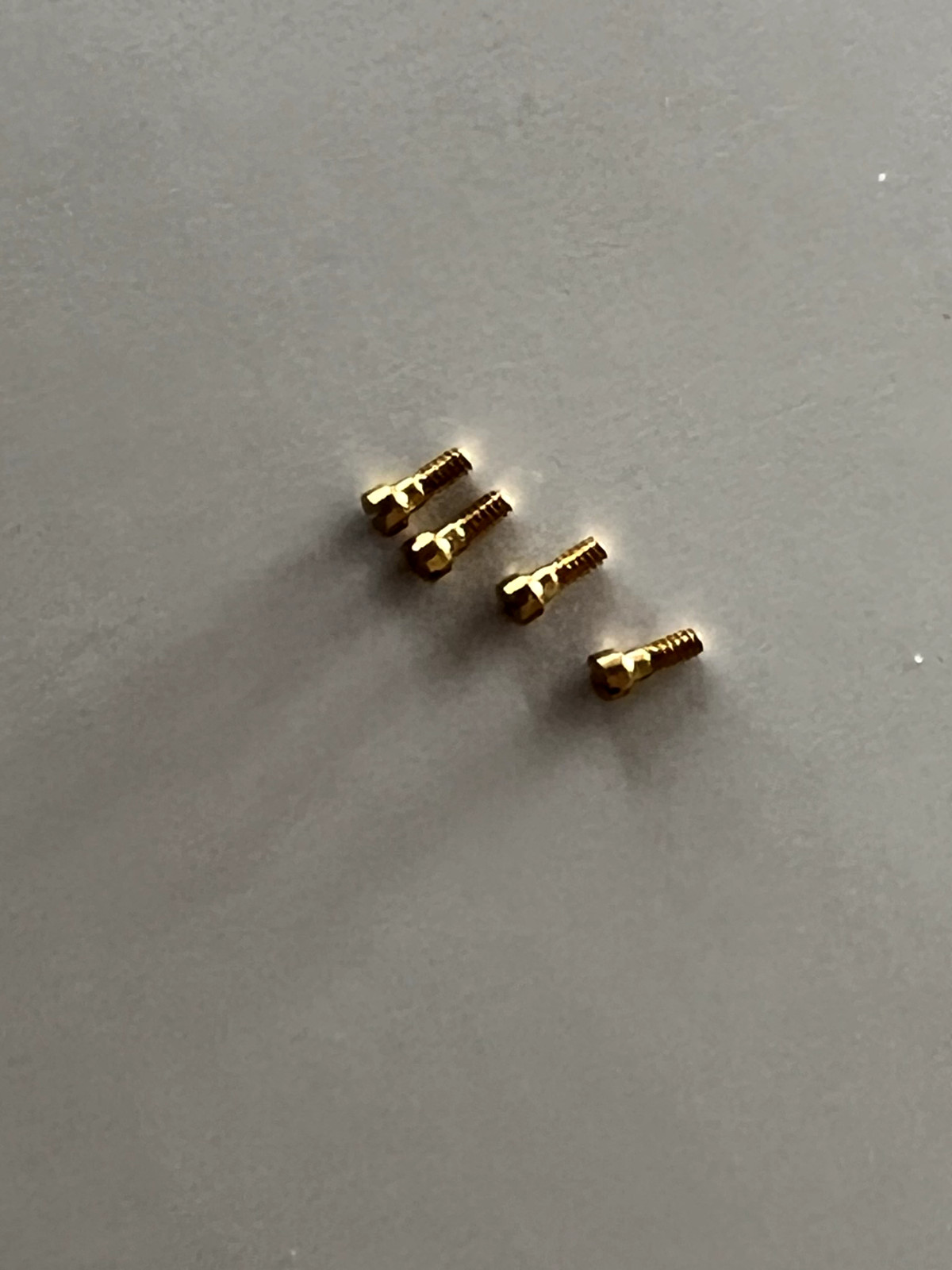 New Piaget 18K gold screw, thread 0.70mm head 1.10mm length 2.50mm One unit. #13