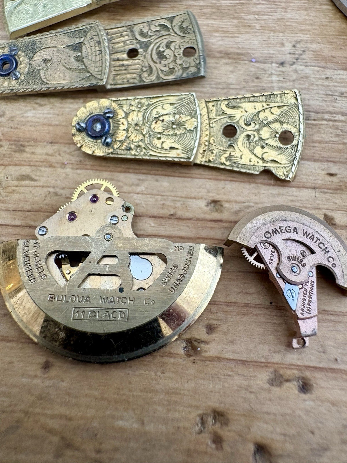 Watchmaker parts Lot w/ Box Movements Dials Gears Bulova Omega Benrus Elgin