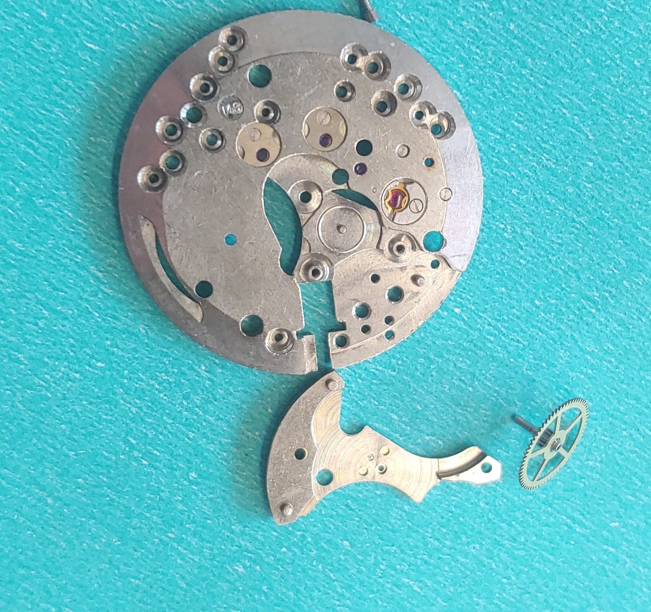 AS Cal. #1187/94 Base Plate, Minute Wheel And Bridge. Screws, Inca Jewel & Clip