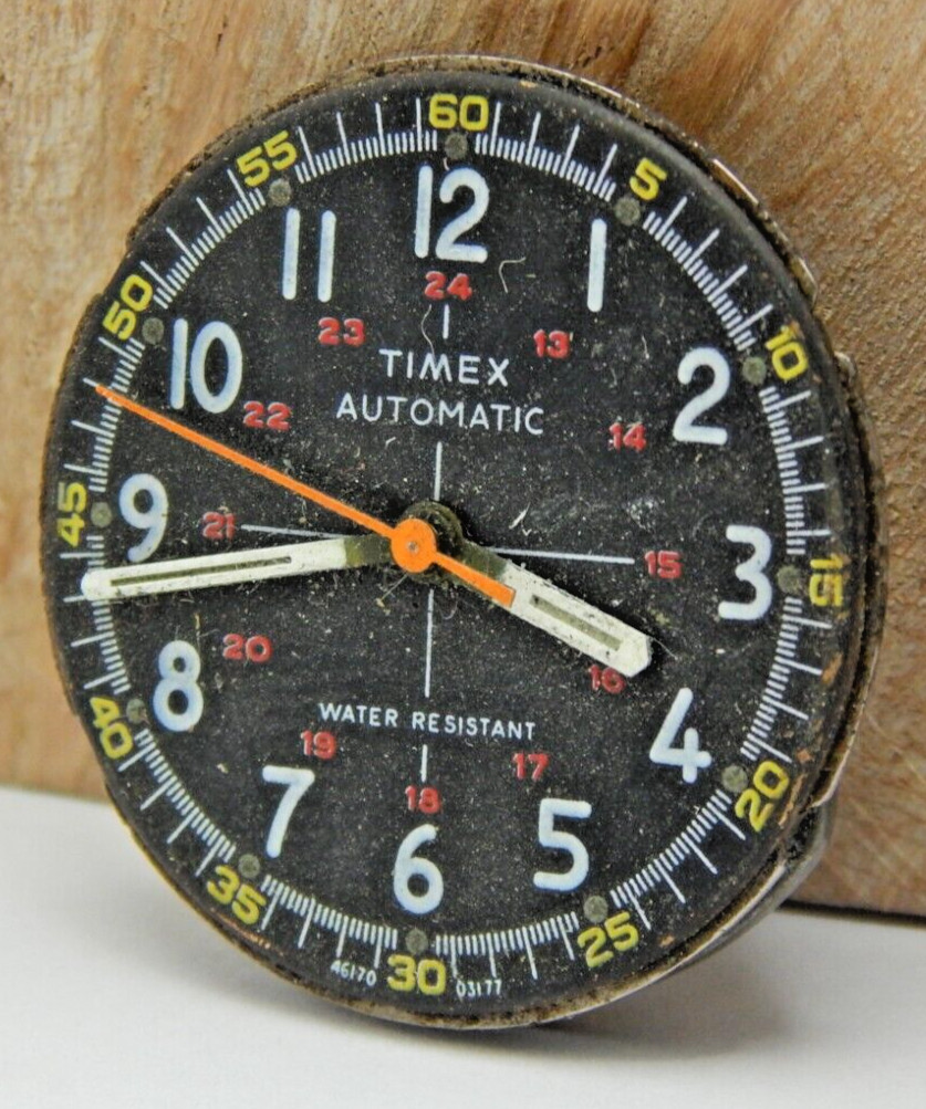 Vintage Timex Automatic men’s wrist watch movement with black dial and hands