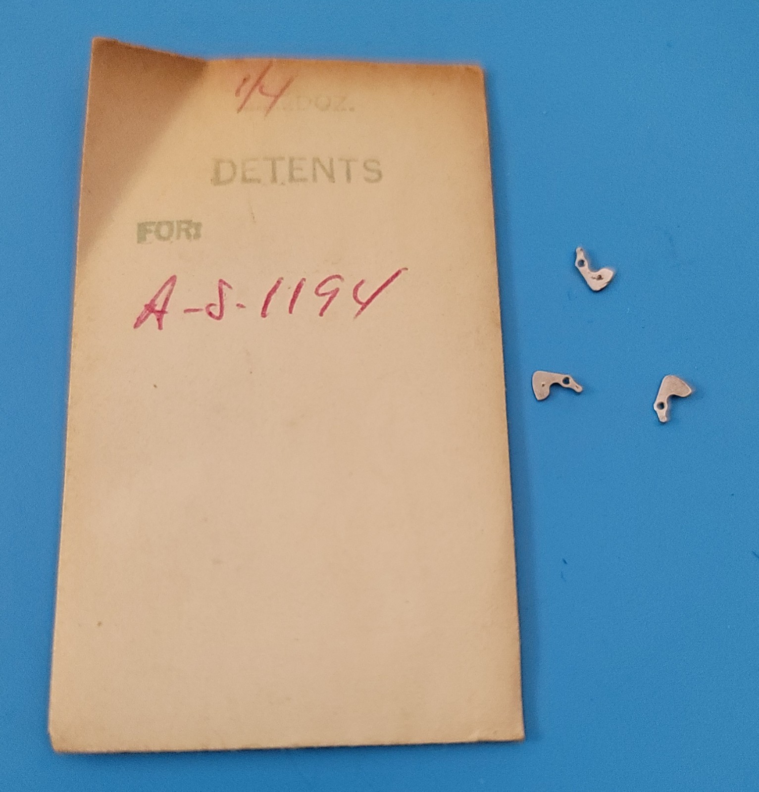 SB2-010: Lot of NOS Watch Parts AS 1187/1194 – Levers, Springs, Staffs, Gears