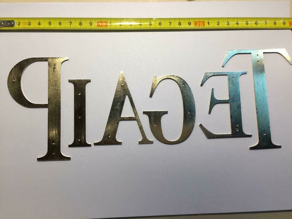Vintage Aluminum Piaget Promotional Letters