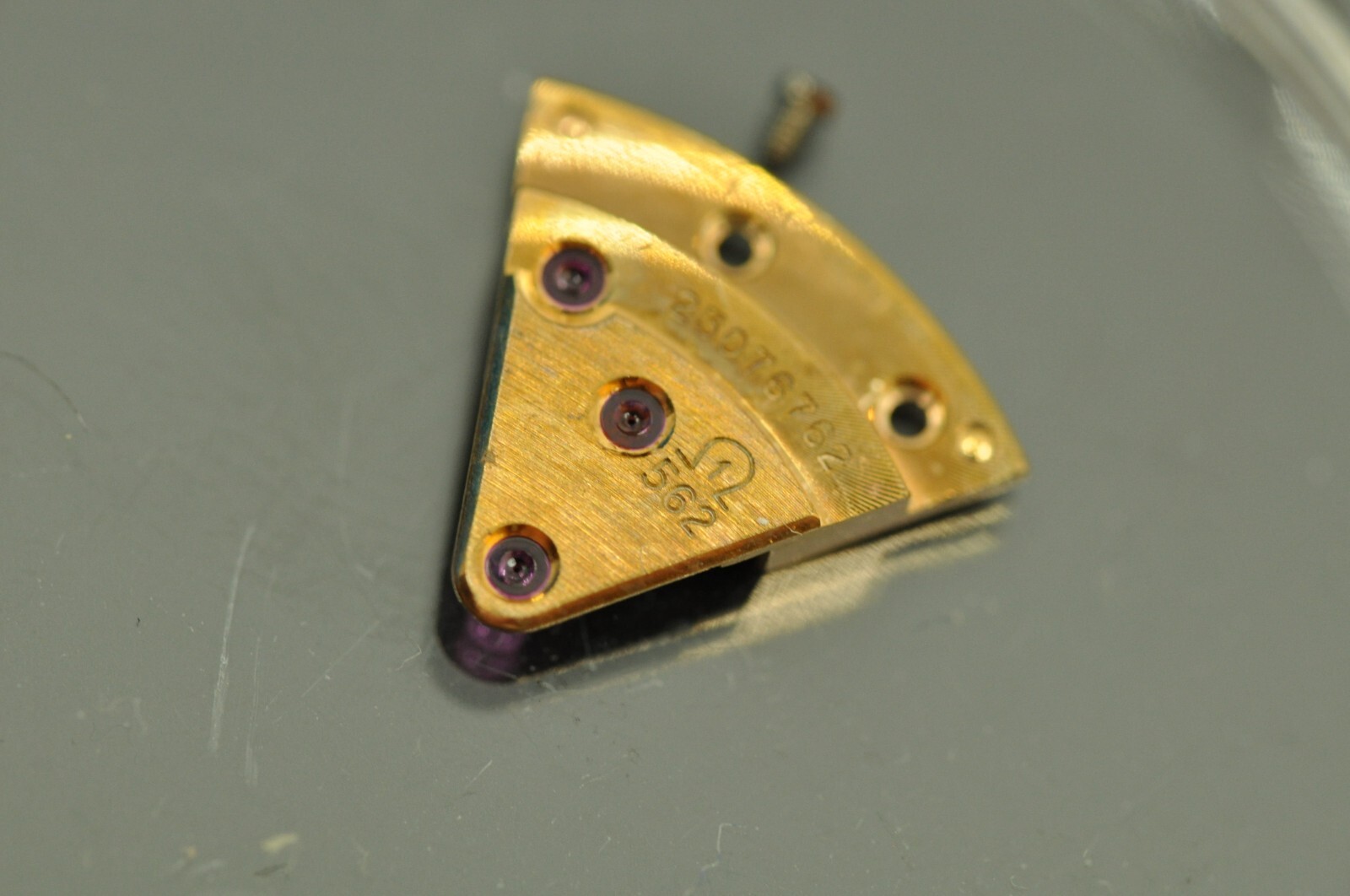 Omega watch part 562-1003 train wheel bridge nice used 23xxxxxxx