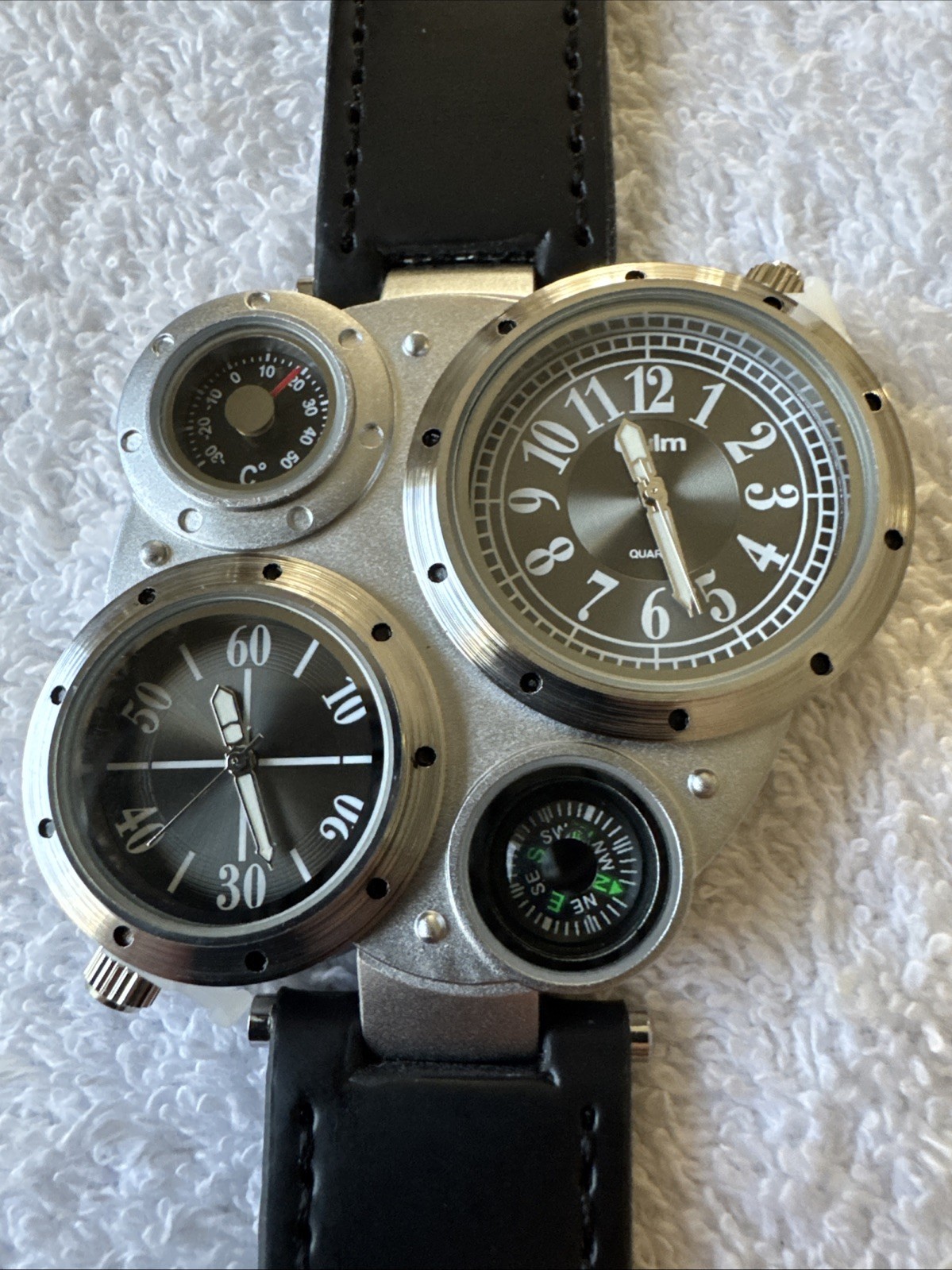 OULM 9415 4 Dial Watch With Two Piece Black Strap Stainless Back