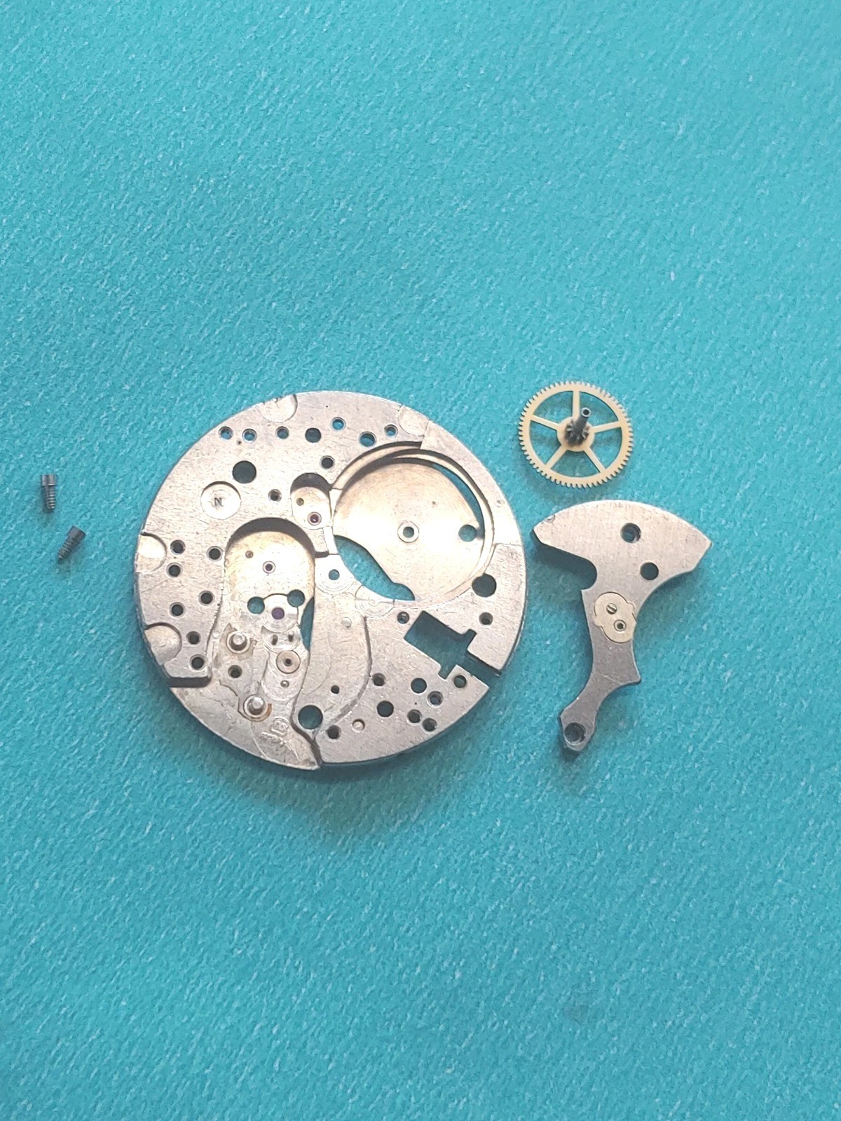 AS Cal. #1187/94 Base Plate, Minute Wheel And Bridge. Screws, Inca Jewel & Clip
