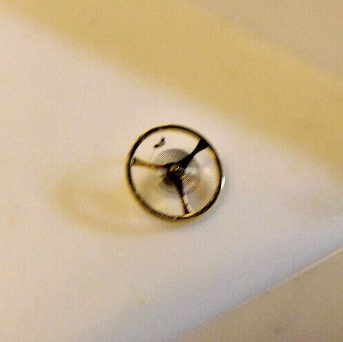 BULOVA 5 BD PART # 54 COMPLETE BALANCE WHEEL. OPEN PACKAGE. NEW OLD STOCK
