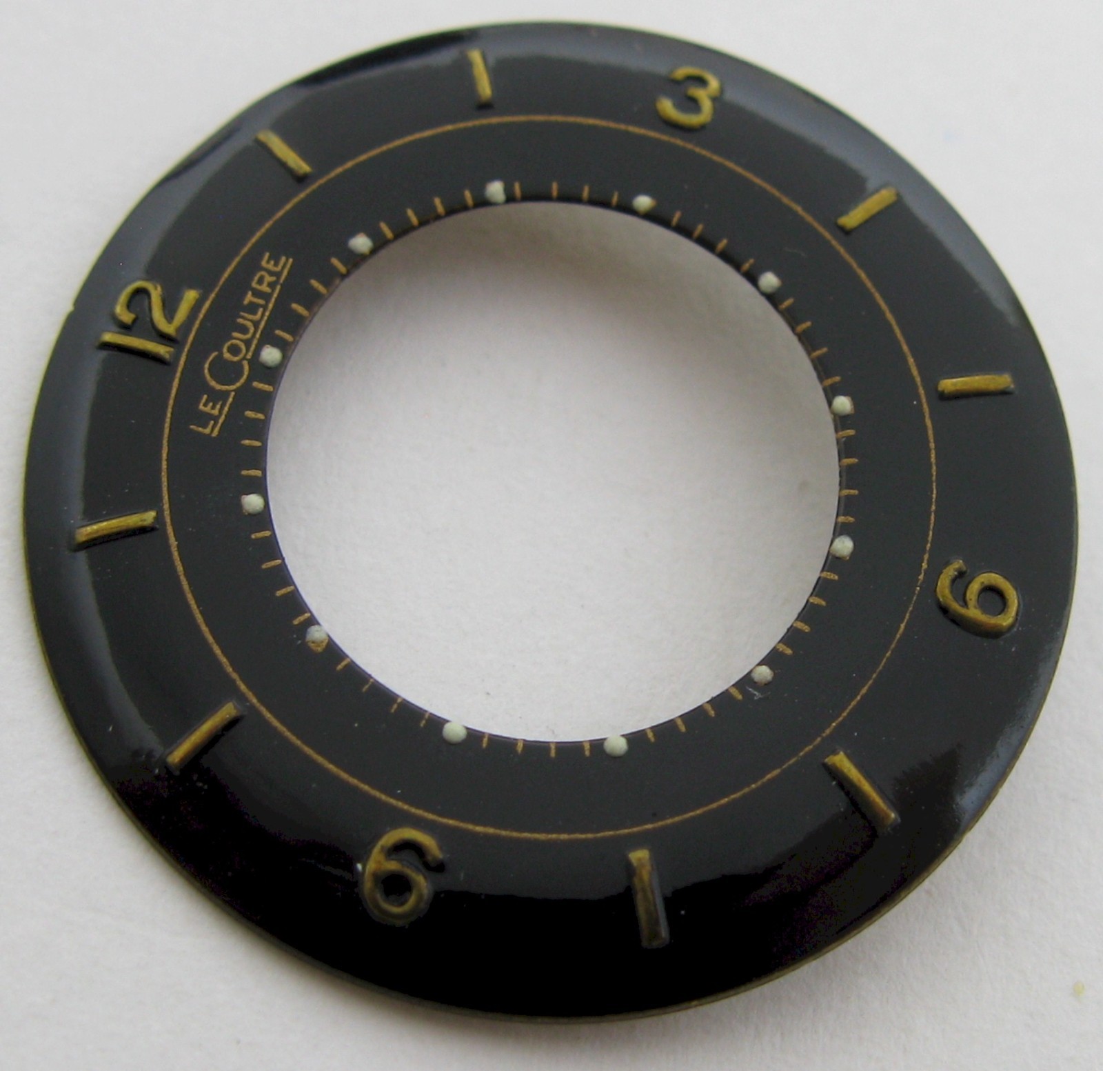 LeCoultre 489 814 … watch movement part: black dial & gilt markers