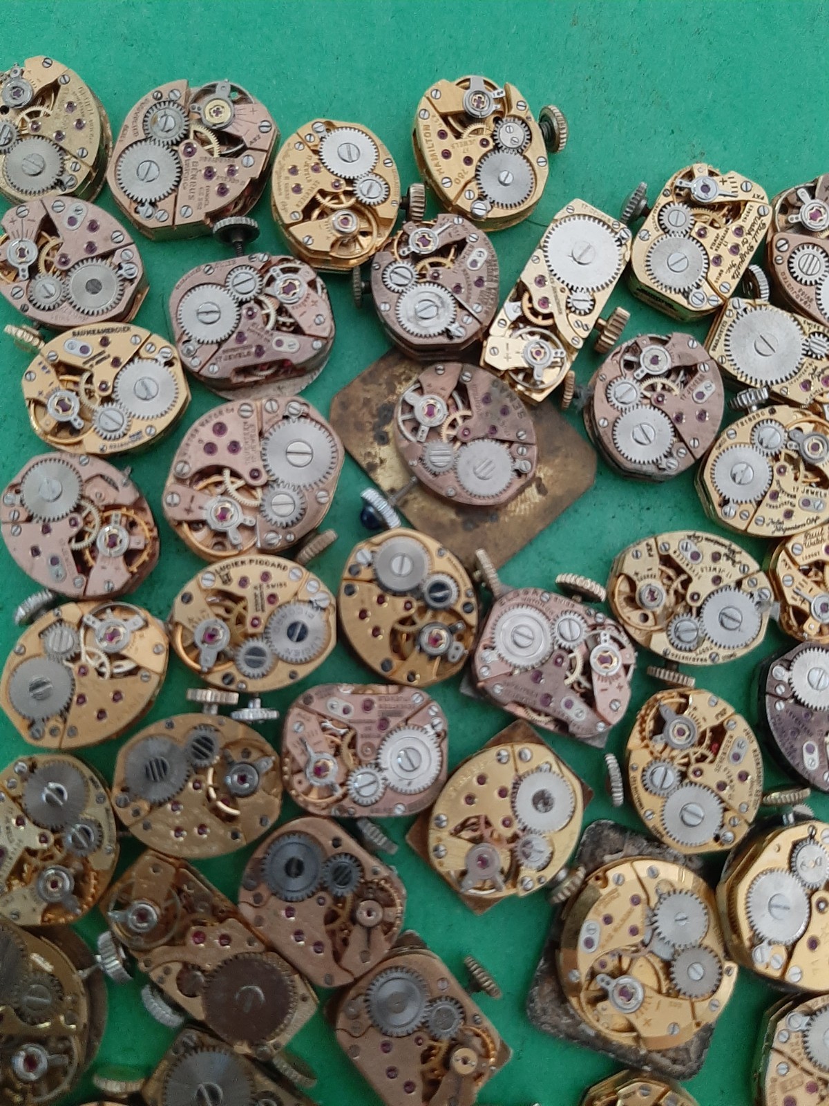 Lot of 60 Mechanical Wrist Watch Movements Parts Repair Manual Gold Cooper Tone