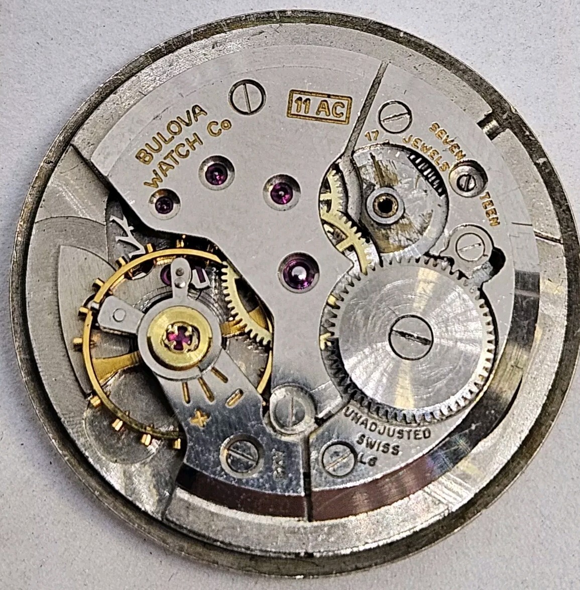Vintage Bulova 11AC 17 jewel wrist watch movement with silver tone dial