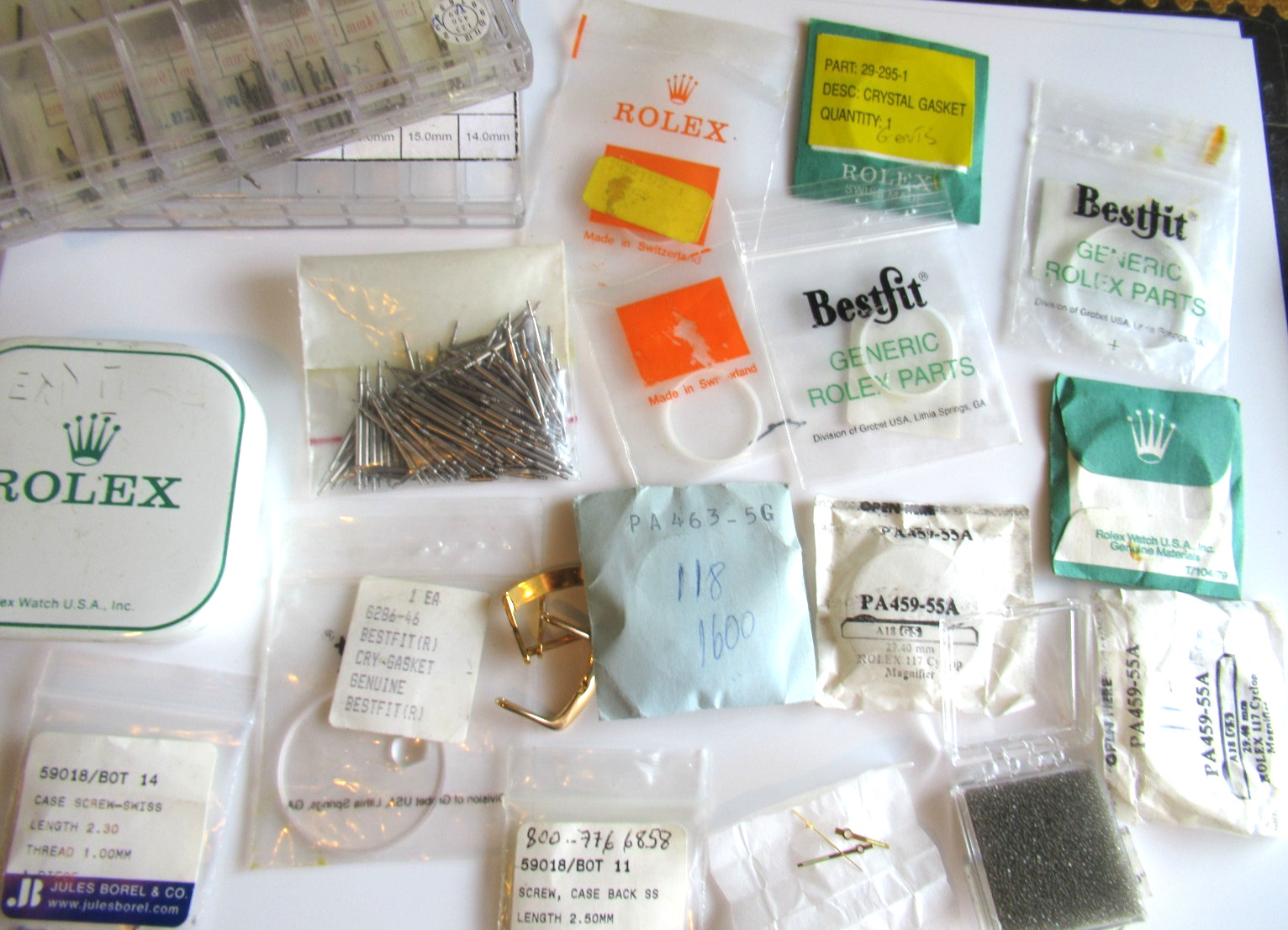 Rolex crystal gaskets hands tin box Various Misc Parts & Brands Lot sold As Is