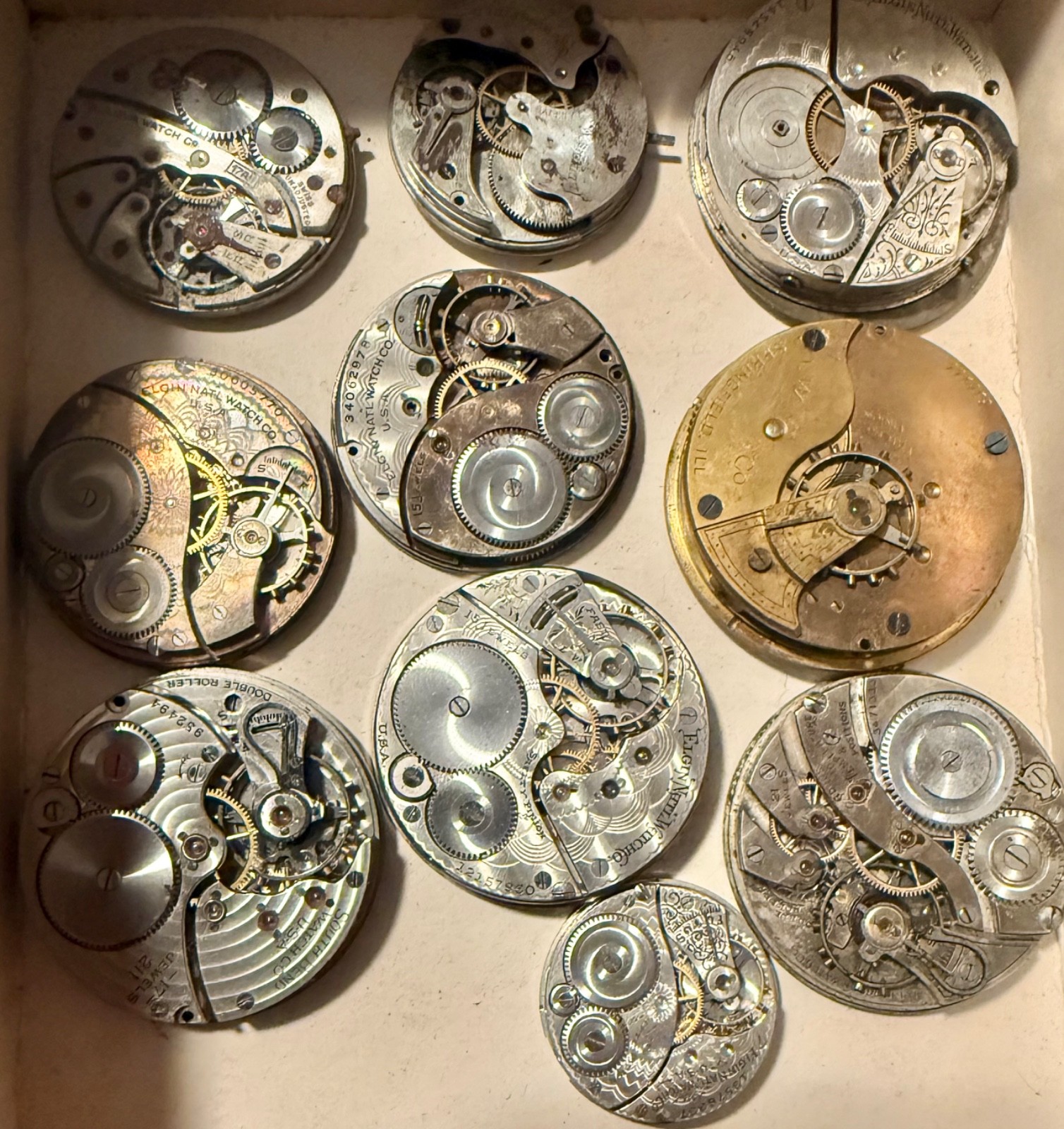 ANTIQUE LOT 10 DIFFERENT NAMES & SIZES POCKET WATCH MOVEMENT SELLING AS IS PARTS