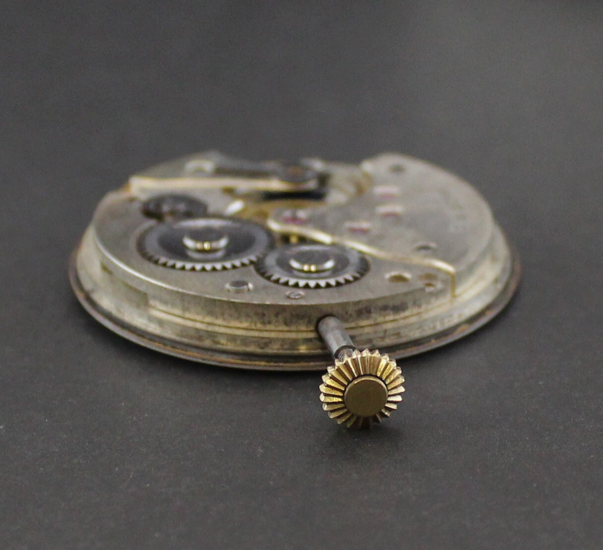 Antique Moeris manual Movement, dial, hands, winding stem & crown . Running!!