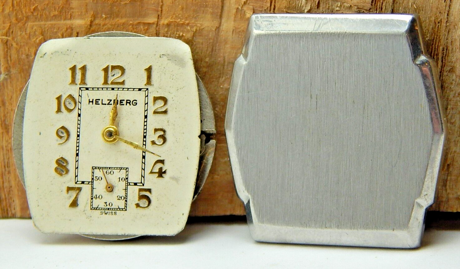 Vintage Helzberg Sleda 14-8 7 jewel men’s wrist watch movement with case back
