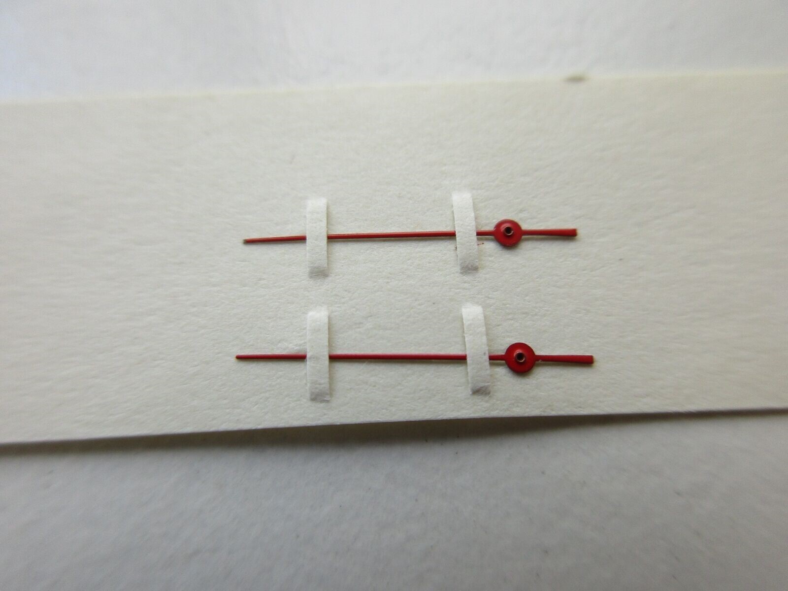 Red seconds watch hand 0.21 – length 11 mm center to tip – 2 pcs