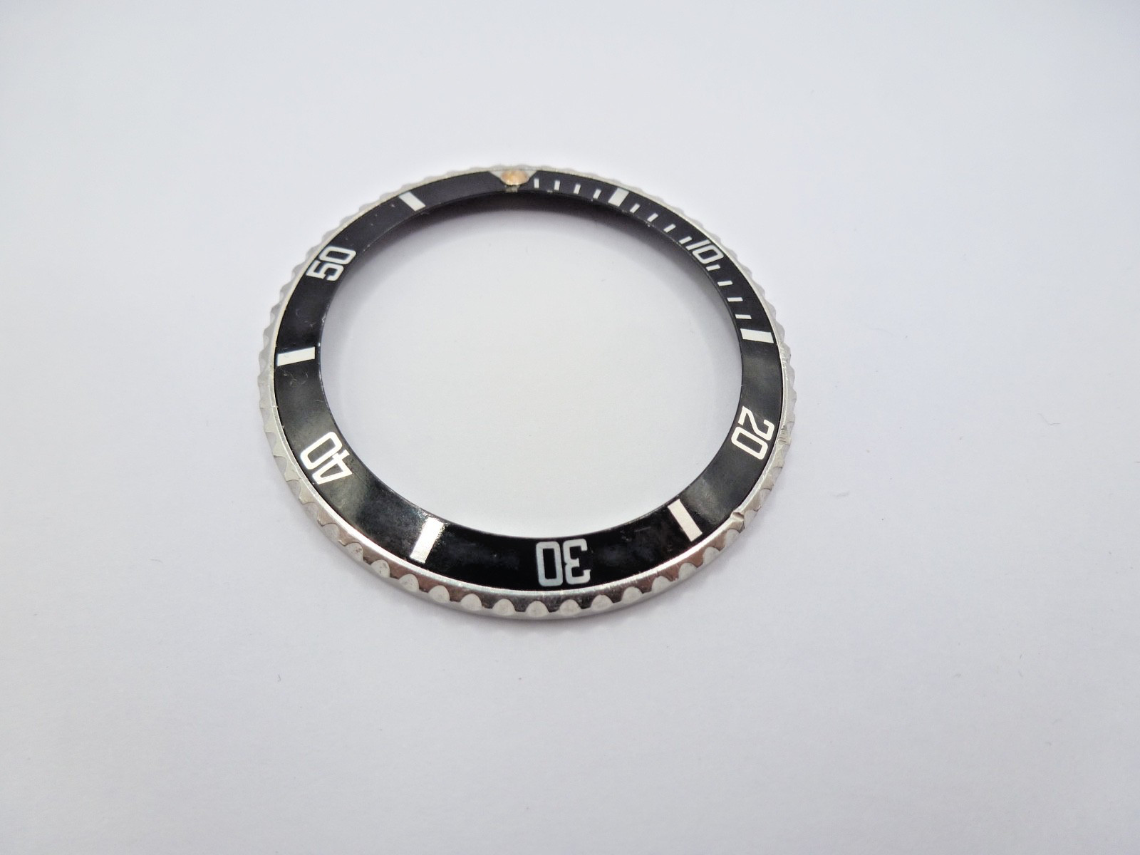 Genuine Rolex Submariner 16610/16800 complete bezel with insert vintage used .