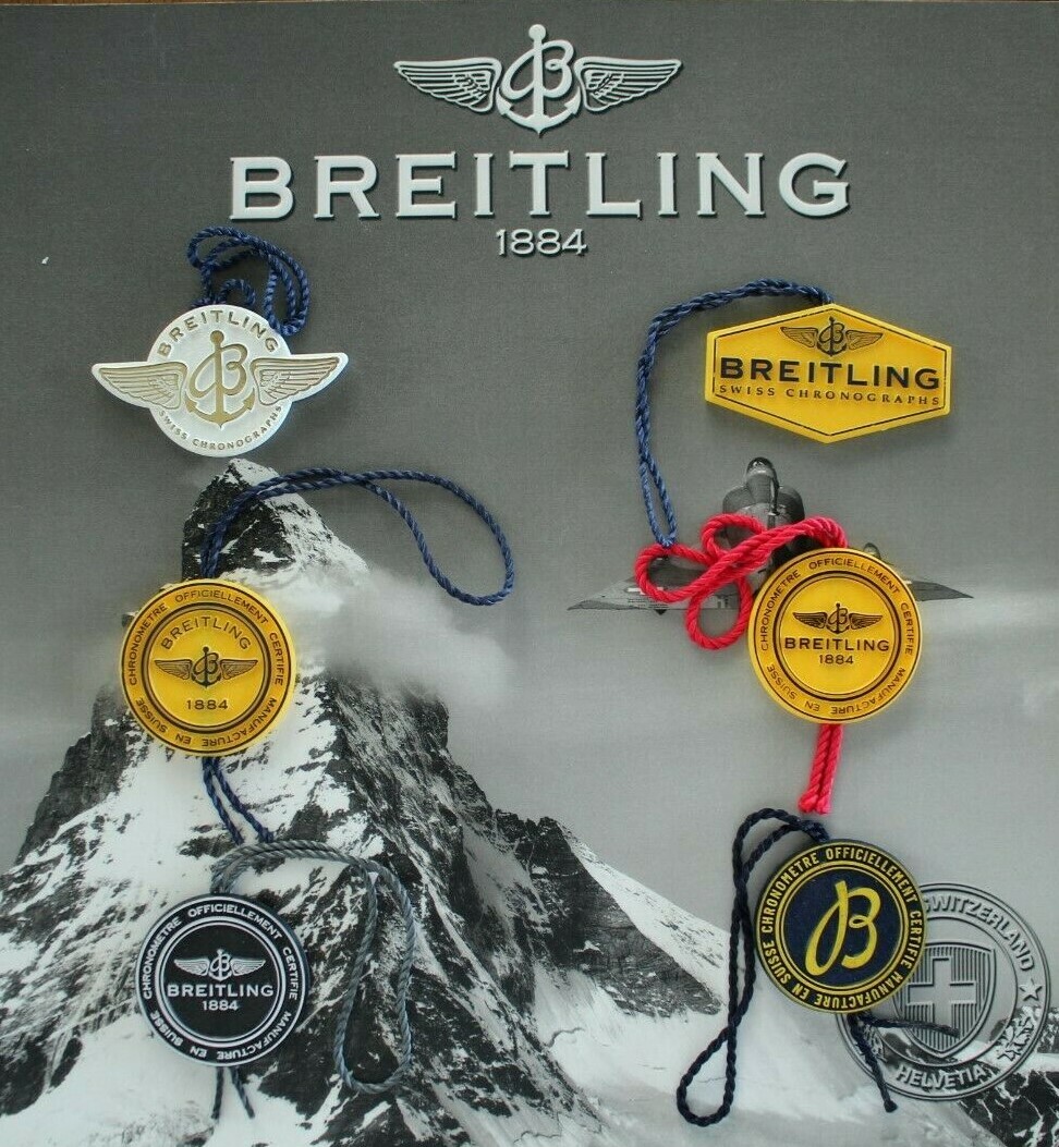 BREITLING FACTORY JEWELER’S BLACK PLASTIC WATCH HANG / SWING TAG THREE PIECE LOT