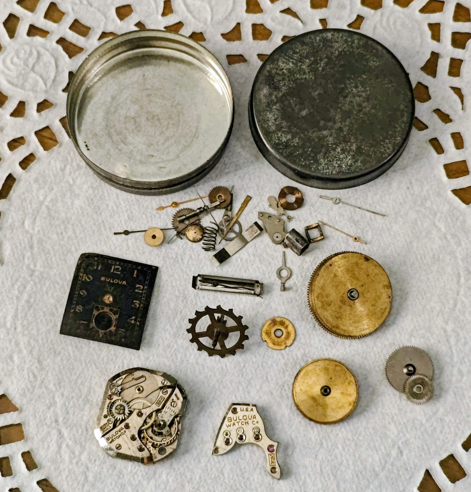 Vintage Watch Parts Including Bulova In A Small Metal Tin Can Approx 13 X 38mm
