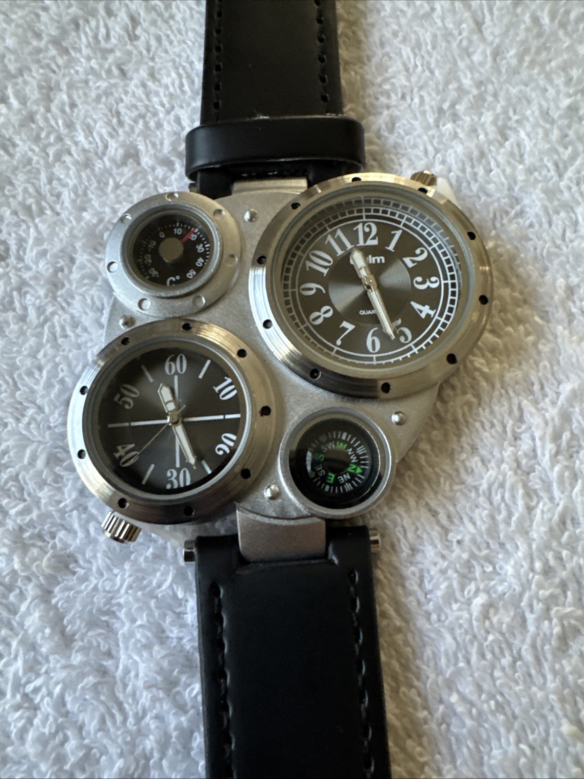 OULM 9415 4 Dial Watch With Two Piece Black Strap Stainless Back