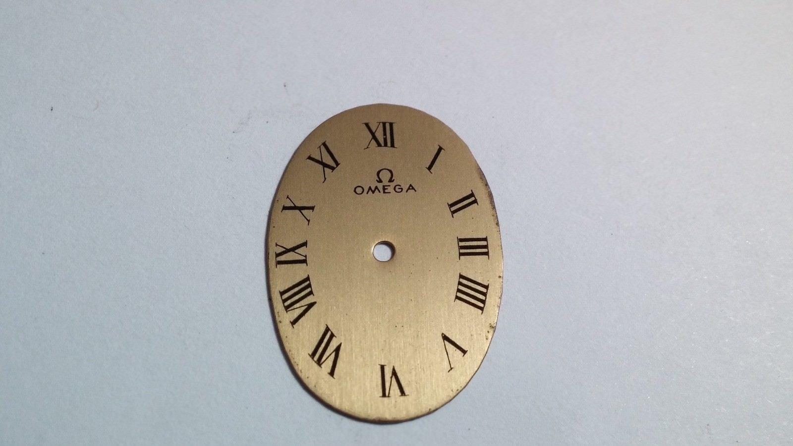 Omega watch dial, oval, arabic numerals, 26.2mm ht, 18.2mm wide, pre-owned, no p
