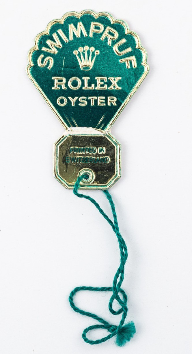 Rolex RARE 1960’s Green Foil Swimpruf Rolex Oyster Swing Hang Tag! NICE shape!
