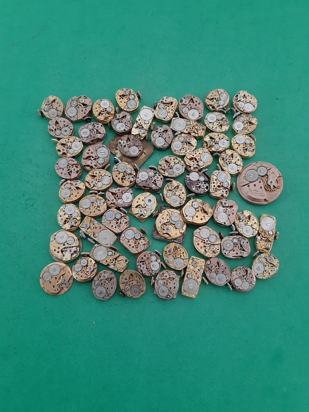 Lot of 60 Mechanical Wrist Watch Movements Parts Repair Manual Gold Cooper Tone