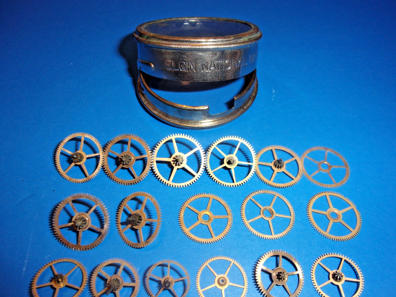 Elgin Pocket Watch Parts, Mix of 3rd and 4th and other power Train Gears + Tin