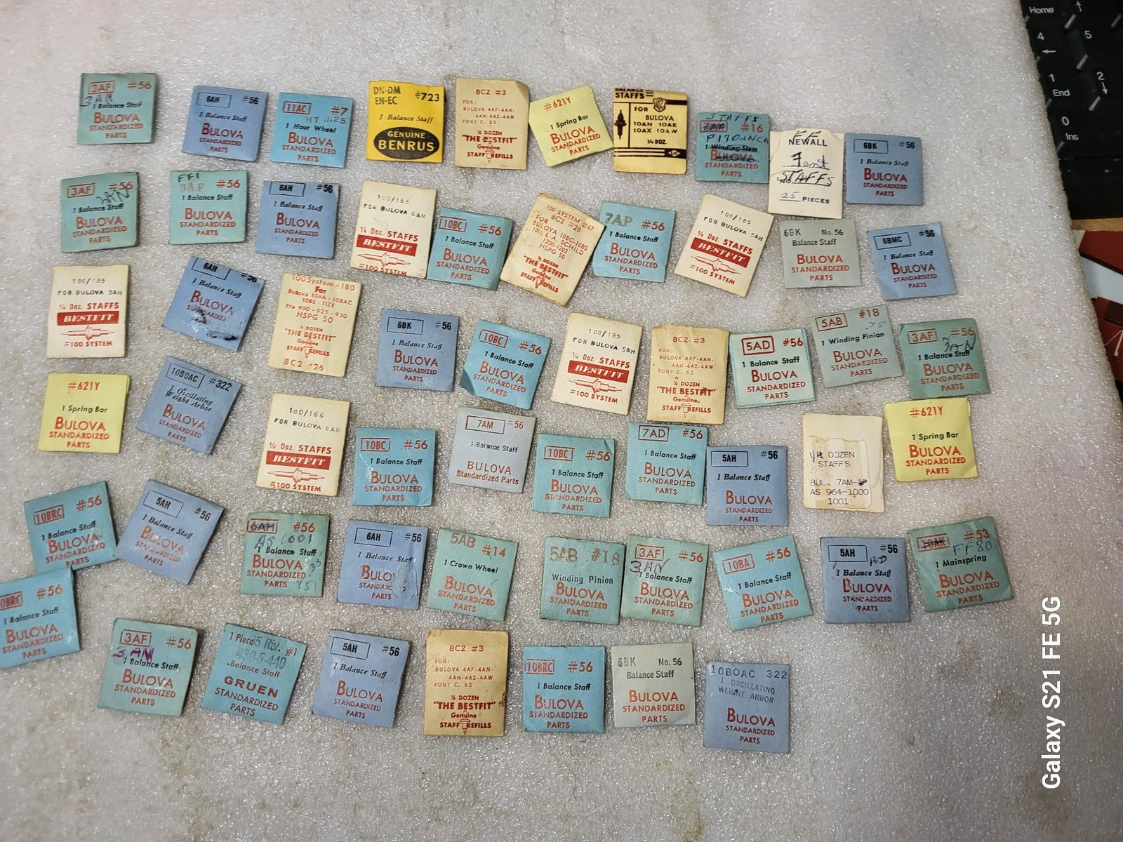 Lot of 58 Packages of Bulova Crown Staff & Balance Wheel Watch Repair Parts