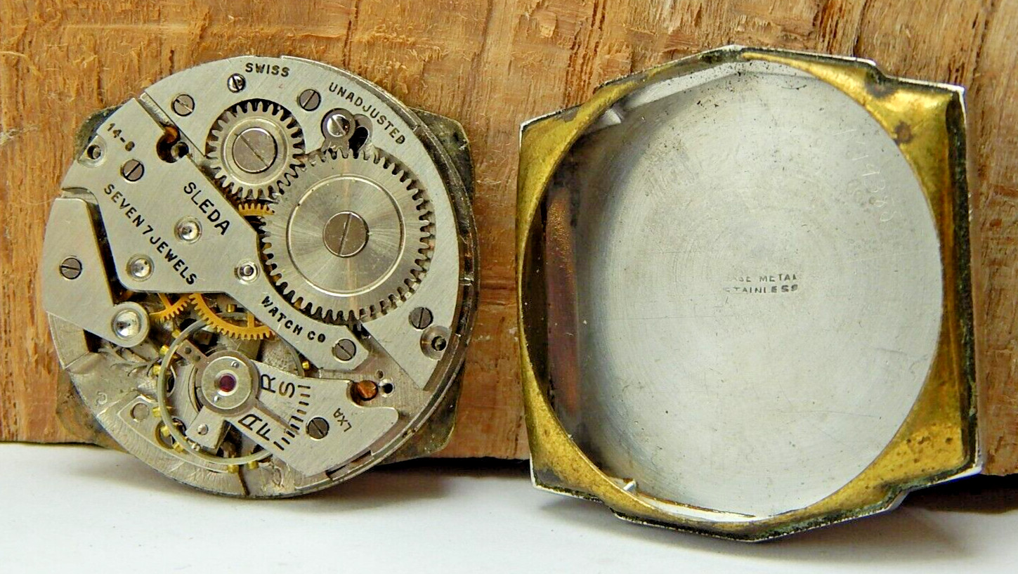 Vintage Helzberg Sleda 14-8 7 jewel men’s wrist watch movement with case back