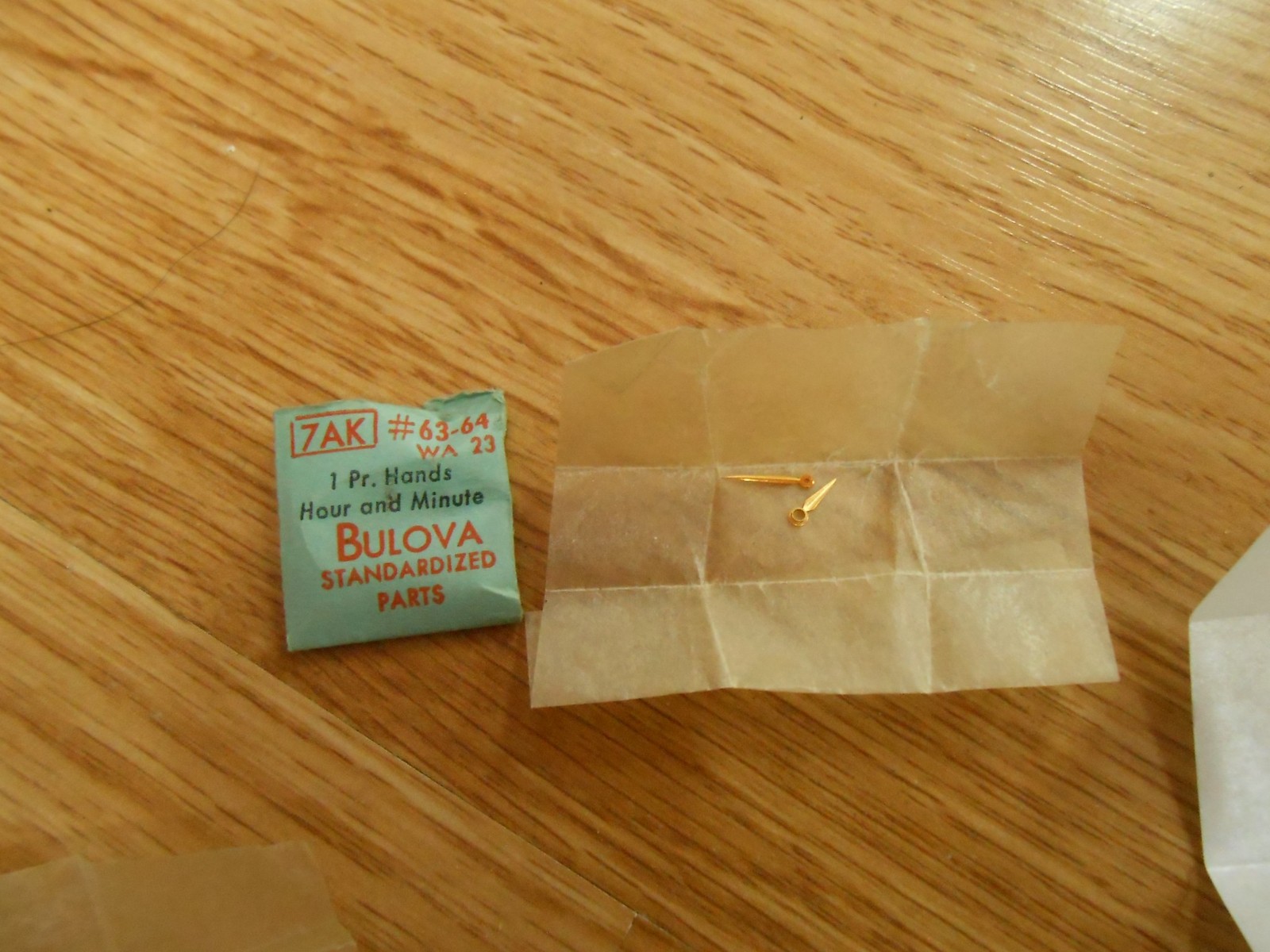 BULOVA watch part 7AK #63-64 hands hour and minute WA 23 gold