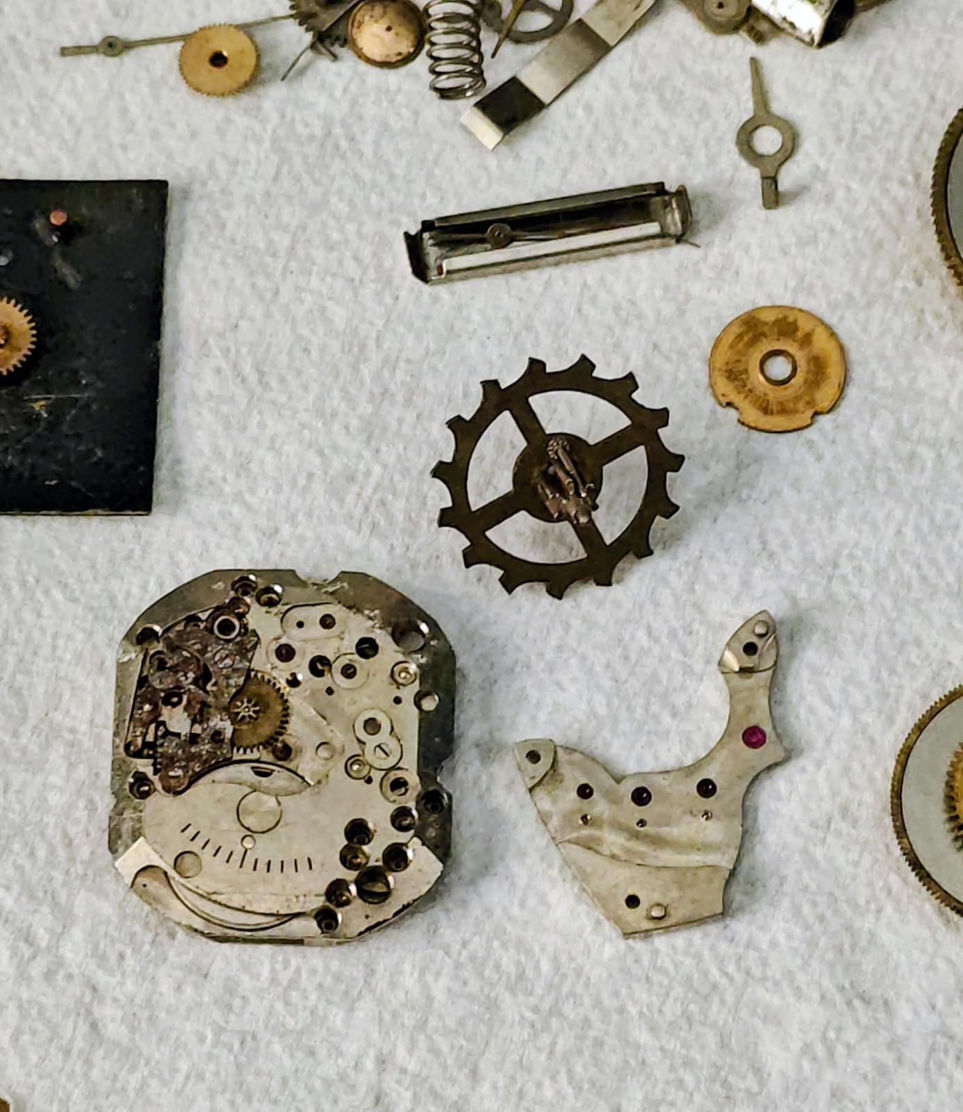 Vintage Watch Parts Including Bulova In A Small Metal Tin Can Approx 13 X 38mm