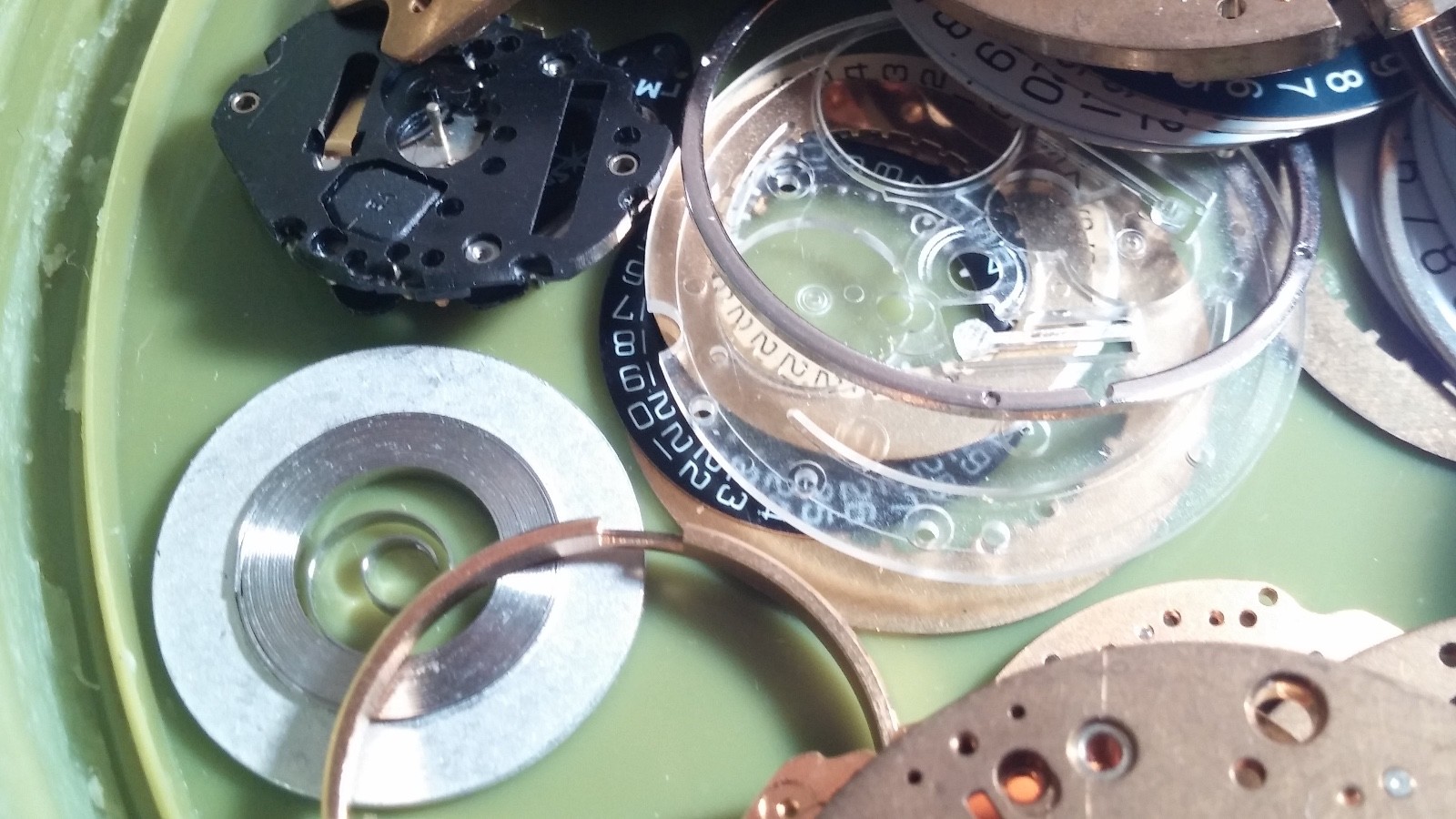 1 LOT of ETA mainplates, parts, calendar date disks, wheels for repair