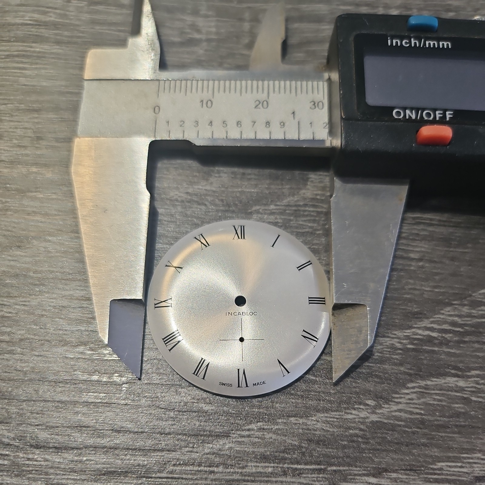NOS INCABLOC WATCH FACE / DIAL SILVER TONE WITH BLACK WRITING 31mm