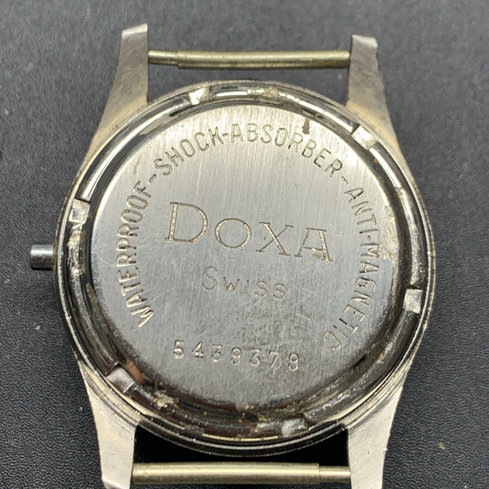 1950s SS NOS Doxa Screw Back Case
